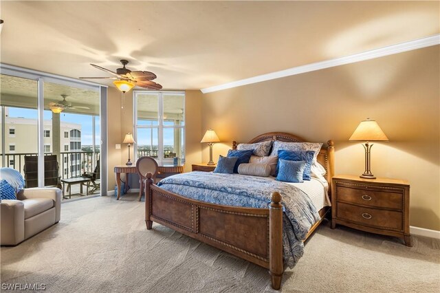 bedroom with crown molding, carpet floors, access to outside, and ceiling fan