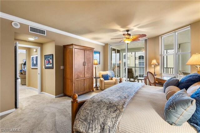 carpeted bedroom with crown molding and ceiling fan