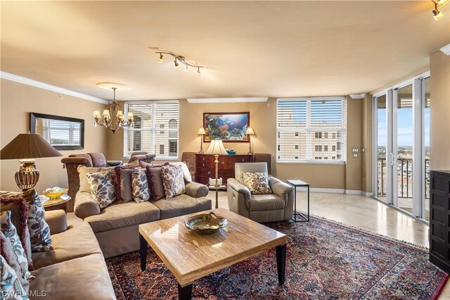 living room featuring a notable chandelier and crown molding