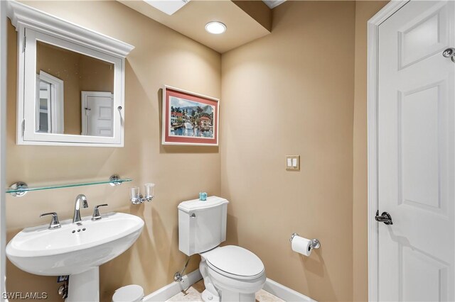 bathroom with toilet and sink