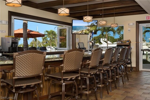 dining area with beam ceiling