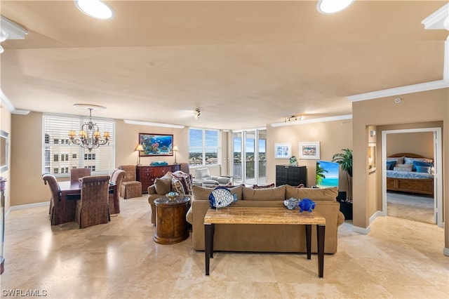 living room with crown molding and a notable chandelier