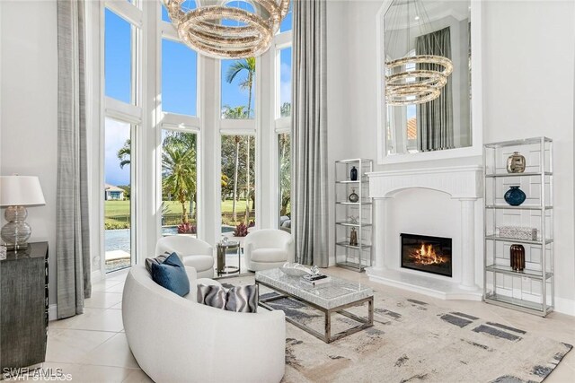 sunroom / solarium featuring an inviting chandelier