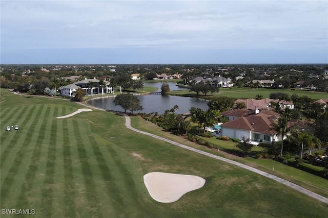 bird's eye view featuring view of golf course and a water view