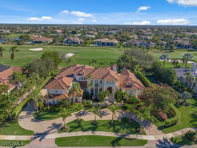 drone / aerial view with a residential view and view of golf course