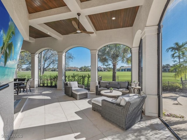 view of patio featuring an outdoor living space, a ceiling fan, and fence