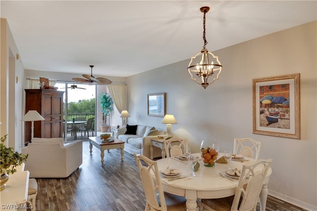 dining room featuring ceiling fan with notable chandelier and dark hardwood / wood-style floors