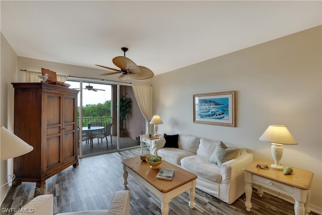 living room with wood-type flooring and ceiling fan