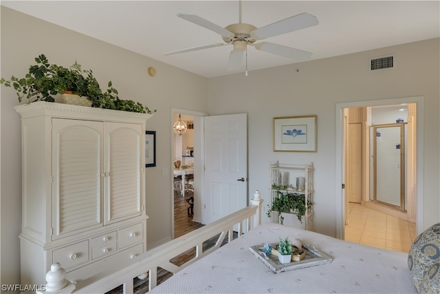 tiled bedroom featuring ceiling fan