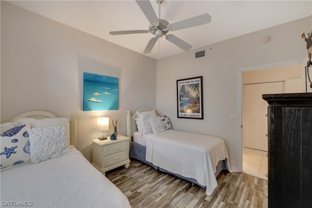 bedroom with hardwood / wood-style flooring and ceiling fan