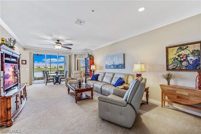 living room featuring light carpet, ceiling fan, and crown molding