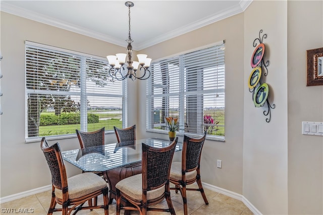 dining area with light tile floors, a notable chandelier, and crown molding