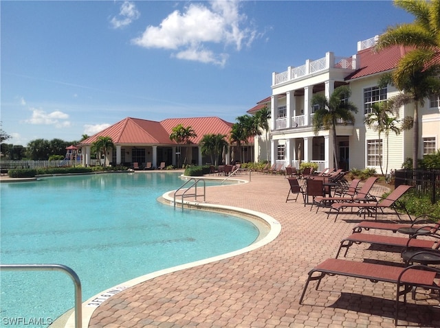 view of swimming pool featuring a patio area