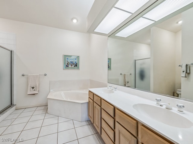 full bathroom featuring toilet, vanity, separate shower and tub, and tile patterned floors