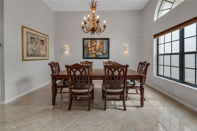 dining space with an inviting chandelier