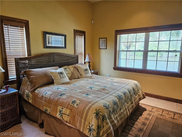 bedroom with light tile patterned flooring