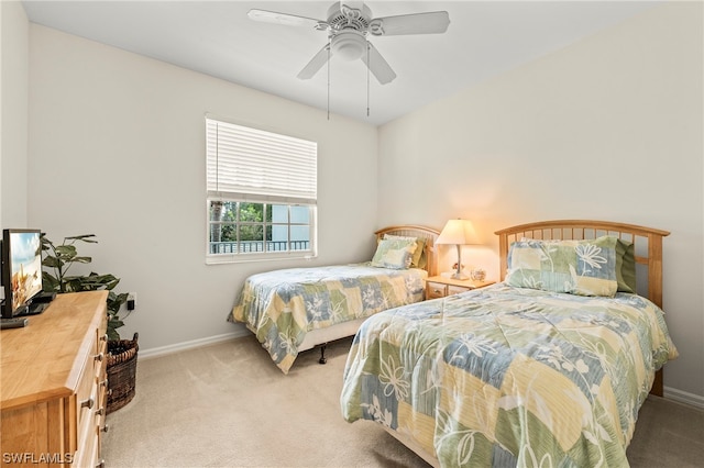 bedroom featuring ceiling fan and light colored carpet