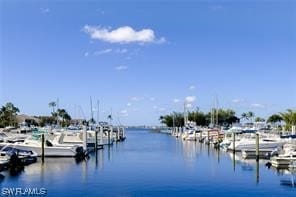 property view of water featuring a boat dock