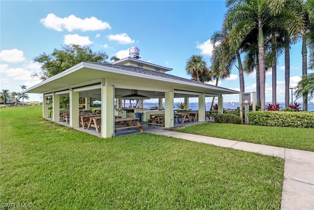 view of property's community with a yard and a gazebo