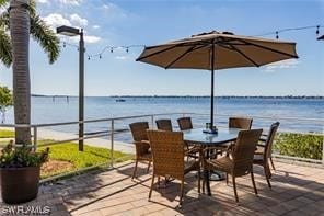 view of patio with a water view