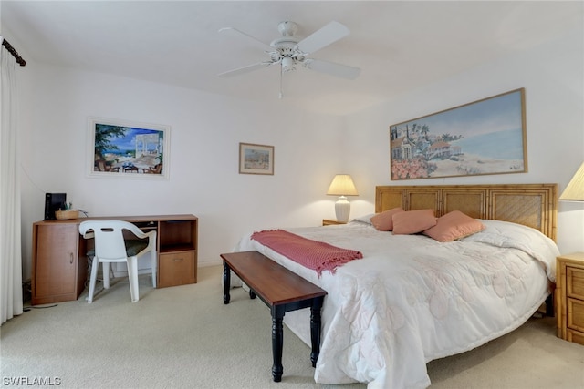 bedroom featuring light carpet and ceiling fan