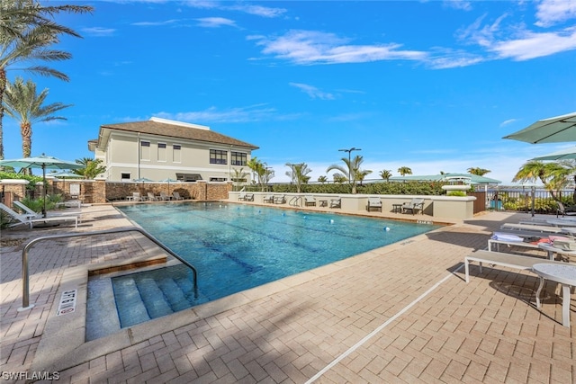 view of swimming pool featuring a patio area