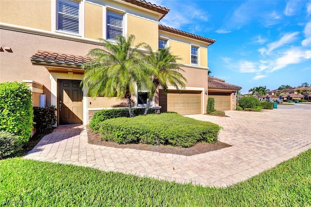 mediterranean / spanish-style home featuring a garage