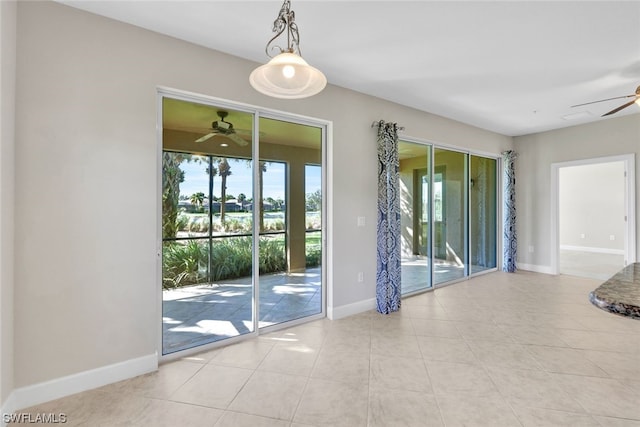 doorway to outside featuring ceiling fan and light tile patterned floors