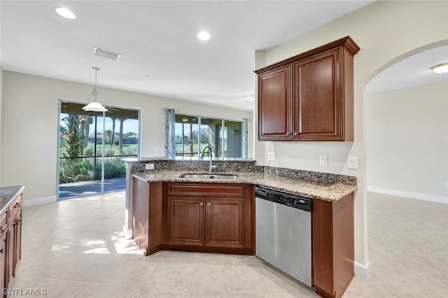 kitchen featuring light tile patterned flooring, dishwasher, hanging light fixtures, stone countertops, and sink