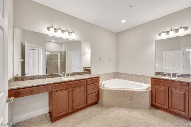 bathroom featuring tile patterned flooring, vanity, and separate shower and tub