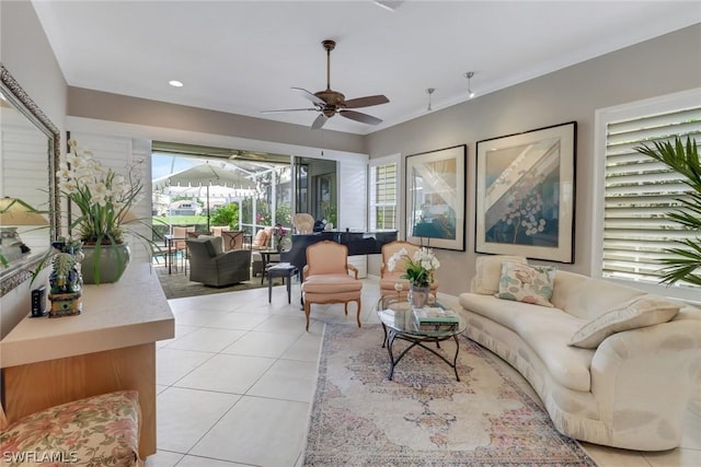 living room featuring ceiling fan and light tile patterned flooring