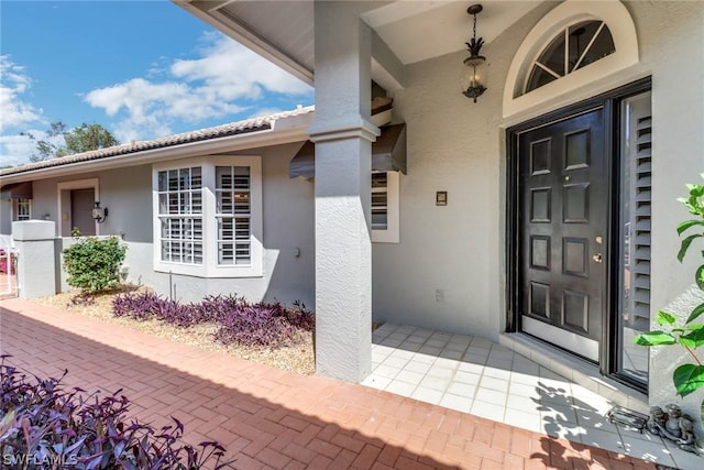 entrance to property with a patio area