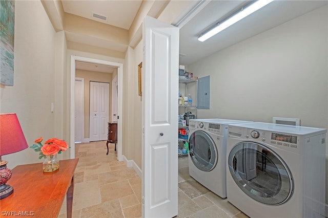 laundry room featuring hookup for a washing machine, washer and dryer, and light tile floors