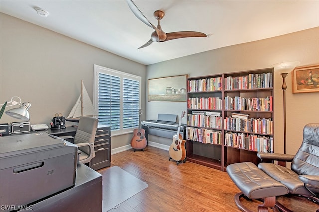 office featuring ceiling fan and light hardwood / wood-style flooring