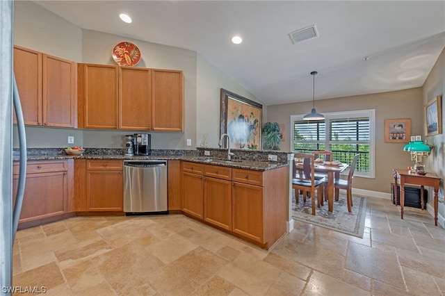 kitchen with stainless steel appliances, sink, light tile floors, and dark stone counters