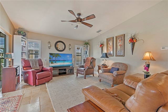 tiled living room with vaulted ceiling and ceiling fan