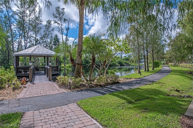 view of nearby features featuring a gazebo, a lawn, and a water view