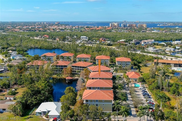 birds eye view of property featuring a water view