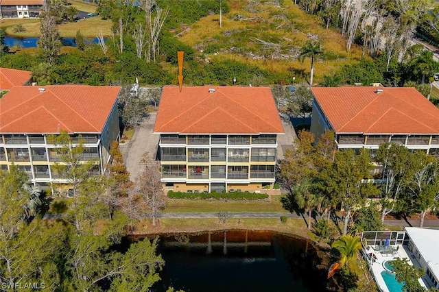 birds eye view of property featuring a water view