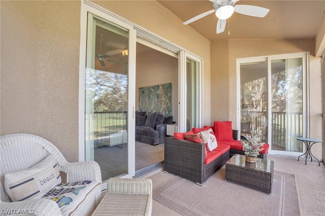 sunroom / solarium with ceiling fan, a healthy amount of sunlight, and lofted ceiling