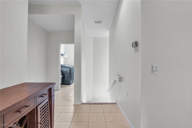 hallway with light tile patterned floors