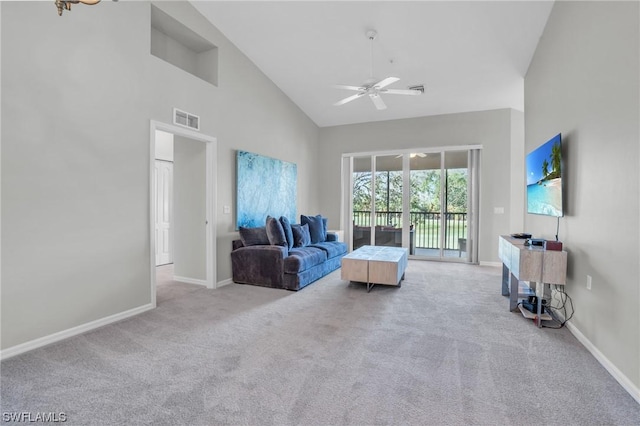 living room featuring high vaulted ceiling, light colored carpet, and ceiling fan