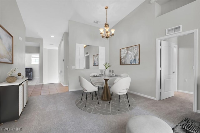 carpeted dining space featuring an inviting chandelier and vaulted ceiling