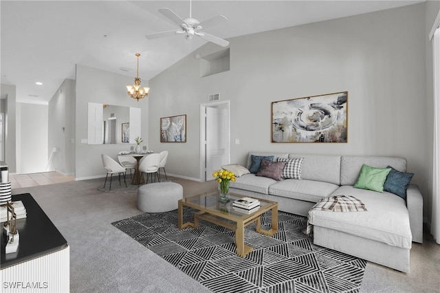 living room with carpet, ceiling fan with notable chandelier, and lofted ceiling