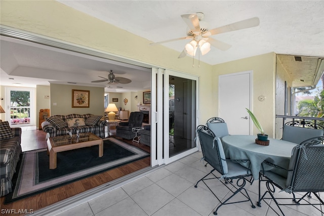 sunroom / solarium with ceiling fan