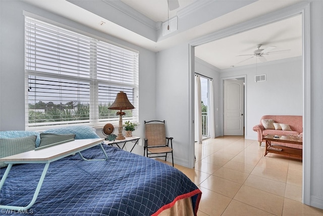 tiled bedroom featuring ceiling fan and crown molding