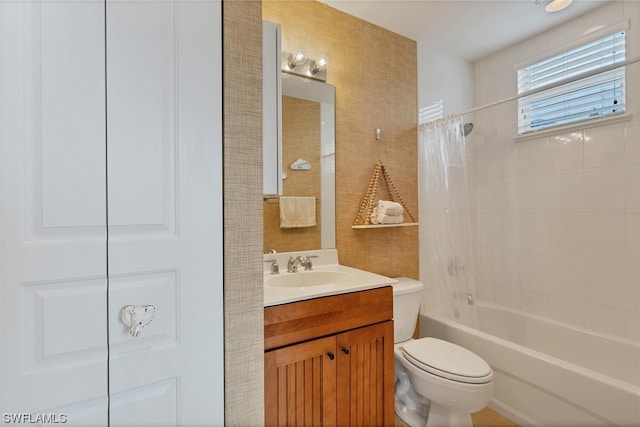 full bathroom featuring toilet, vanity, and shower / bath combo with shower curtain