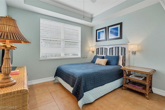 bedroom featuring ornamental molding, light tile flooring, ceiling fan, and a tray ceiling