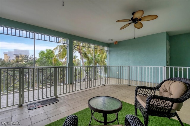 sunroom / solarium with ceiling fan