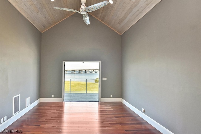 spare room featuring wood ceiling, baseboards, and wood finished floors